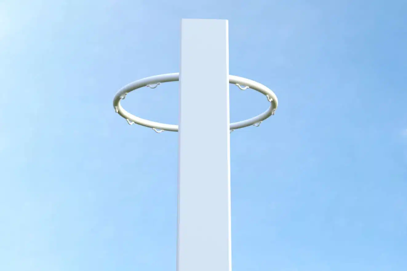 NBES-R2 - RMA Sport Basketball hoop ring attached to a tall white post against a clear blue sky. The backboard is not visible in the image.