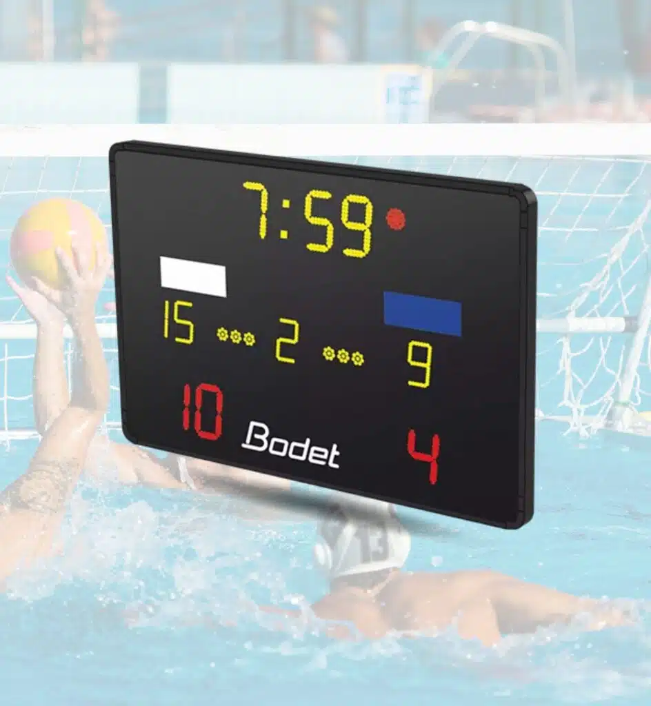 Waterpolo Scoreboard - RMA Sport Electronic poolside scoreboard showing 7:59 and team scores of 15 and 9, with a ball and players in the background and Bodet branding.