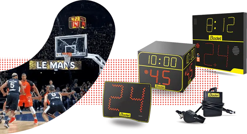 Whistle stop - RMA Sport Basketball game underway with players in dark and orange uniforms; a crowd in the stands and several Bodet digital scoreboards showing time and scores.