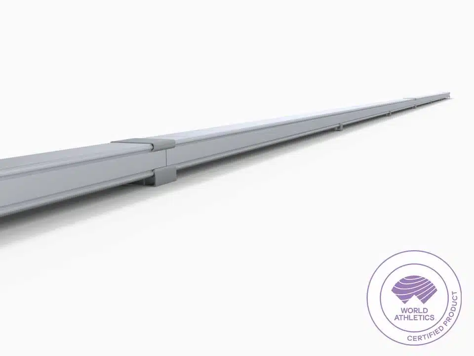 Running Rail Plates - world-athletics-certified-track-curbing-2 - RMA Sport Long gray modular track component extending toward the horizon, with a World Athletics certified product seal in the bottom-right corner.